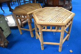 A set of two bamboo side tables.