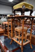 A collection of 20th century Bamboo plant stands.