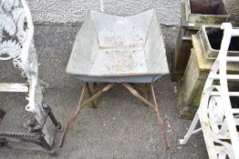 A vintage galvanised wheel barrow.