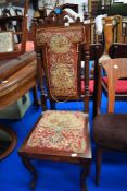 A 19th Century mahogany hall chair having tapestry style back and seat