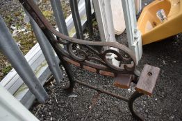 Two vintage cast bench ends.