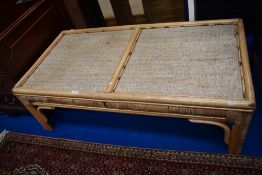 A vintage Bamboo framed coffee table.