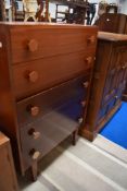 A mid century Castle Teak chest of five drawers.