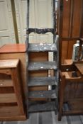 A pair of vintage step ladders.