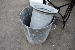 A galvanised grain bin and similar.