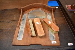 An Edwardian hall way brush and mirror set.