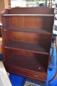 A modern Rossmore waterfall bookshelf with drawer to base