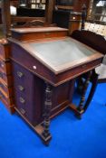 A Victorian Davenport having side drawers and compartmental inner.