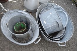 Four vintage galvanised wash tubs and similar.