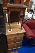 A modern pine bed side cabinet with side table.