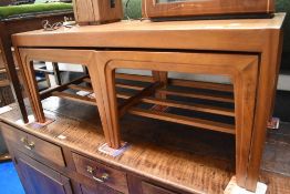 A mid century nest of Remploy teak tables