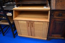 A pair of matching golden oak bed side cabinets.