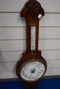 A banjo form barometer with enamel dial,