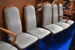 A set of six upholstered dining chairs with Beech wood frames.