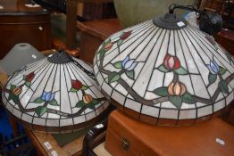 Two large Tiffany style leaded light ceiling shades.