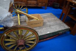An early 20th century folk art style dog cart with Gypsy style paint work.
