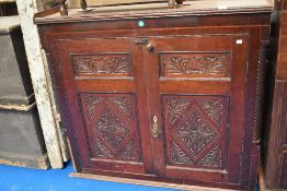 A early 20th century carved oak cupboard top.