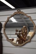 A vintage lozenge shaped wall mirror with painted and moulded frame.
