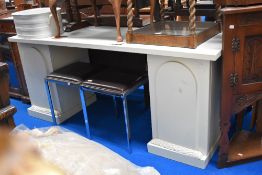A modern pedestal console table.