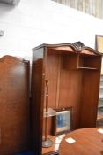 An early 20th Century mahogany and walnut double wardrobe