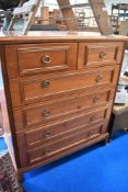 A modern reproduction chest of two over four drawers.