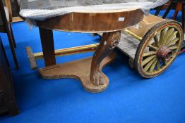 A Victorian console table stand in the form of a lions foot missing its top.