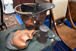 A vintage copper coal bucket with a jelly mold and a chocolate pot.