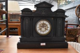 A Victorian slate mantel clock in an architectural style.