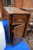 A 1950's utility dining table with under storage and drawer.