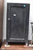 An early 20th century painted pine pot cupboard.
