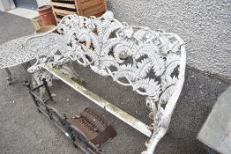 A vintage cast metal fern leaf design bench.