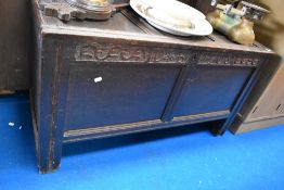 An 18th century oak coffer having carved initials and date for DB 1708
