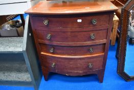 A small 20th century bow fronted chest of four drawers.
