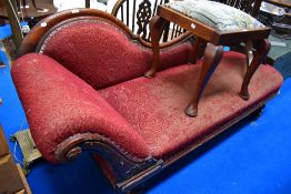 A Victorian Chaise lounge or fainting couch with shaped frame work.
