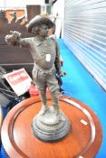 A spelter figure modelled as a cavalier