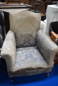 An early 20th century Howard style easy arm chair.