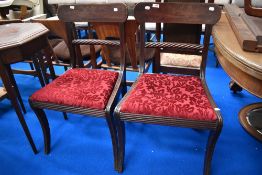 A pair of Victorian mahogany dining chairs having twist rail back