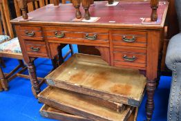 An early 20h century knee hole desk with drawers.
