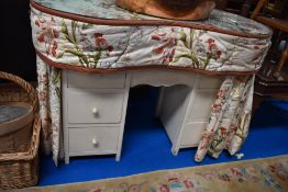 A mid century kitsch style kidney shaped dressing table.