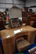 An Art Deco style dressing table with two foot stools.