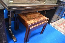 A Priory style oak drawer leaf refectory style dining table, probably Ercol