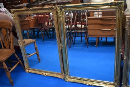 Two gilt framed and bevel edged mirrors.