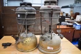 A pair of paraffin camping gas lamps.