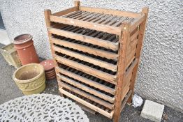 A vintage apple store or fruit drying rack.