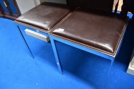 A pair of Italian designer side table with chrome frames and leather tops.