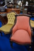 Two antique upholstered chairs both with carved frames.