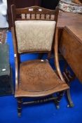 An early 20th century rocking chair with beech wood frame.