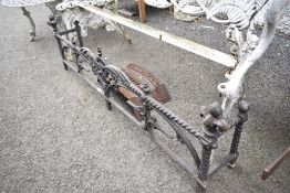 A Victorian cast iron fire guard and hearth.