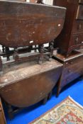 Two early 20th century drop leaf dining tables in oak.