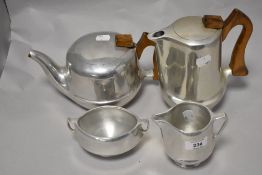 A vintage Mid century Picquot ware stainless steel tea set.